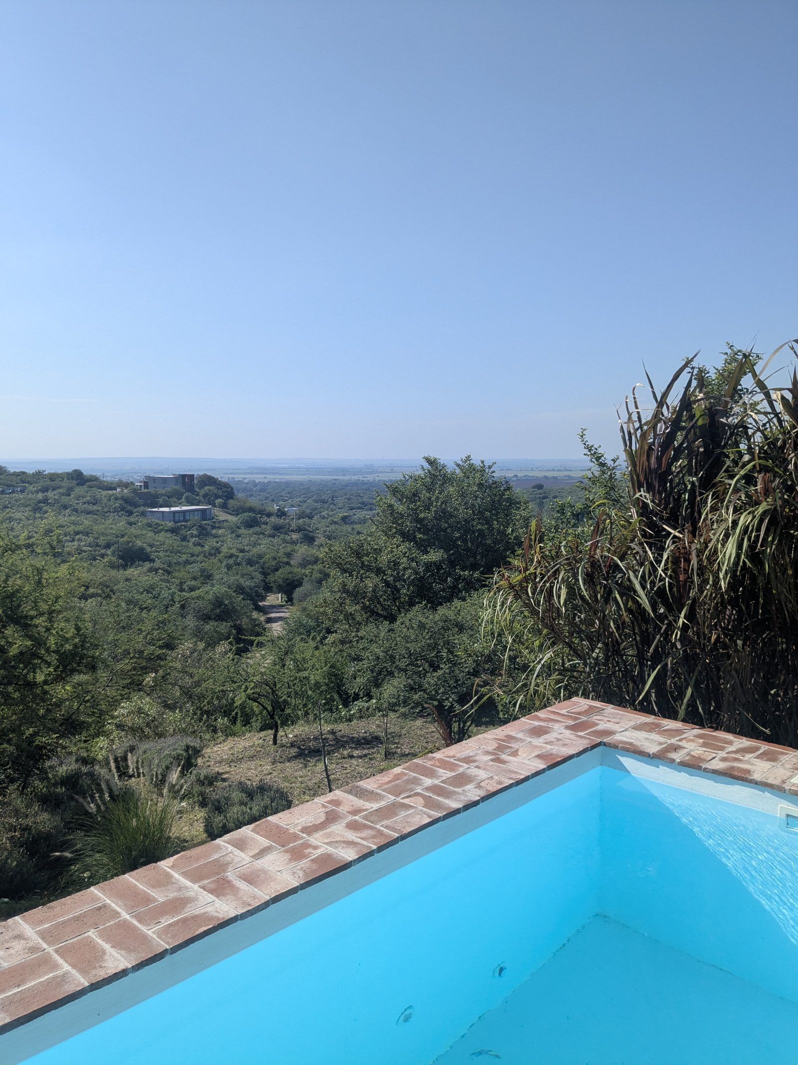Pool edge with panoramic valley view